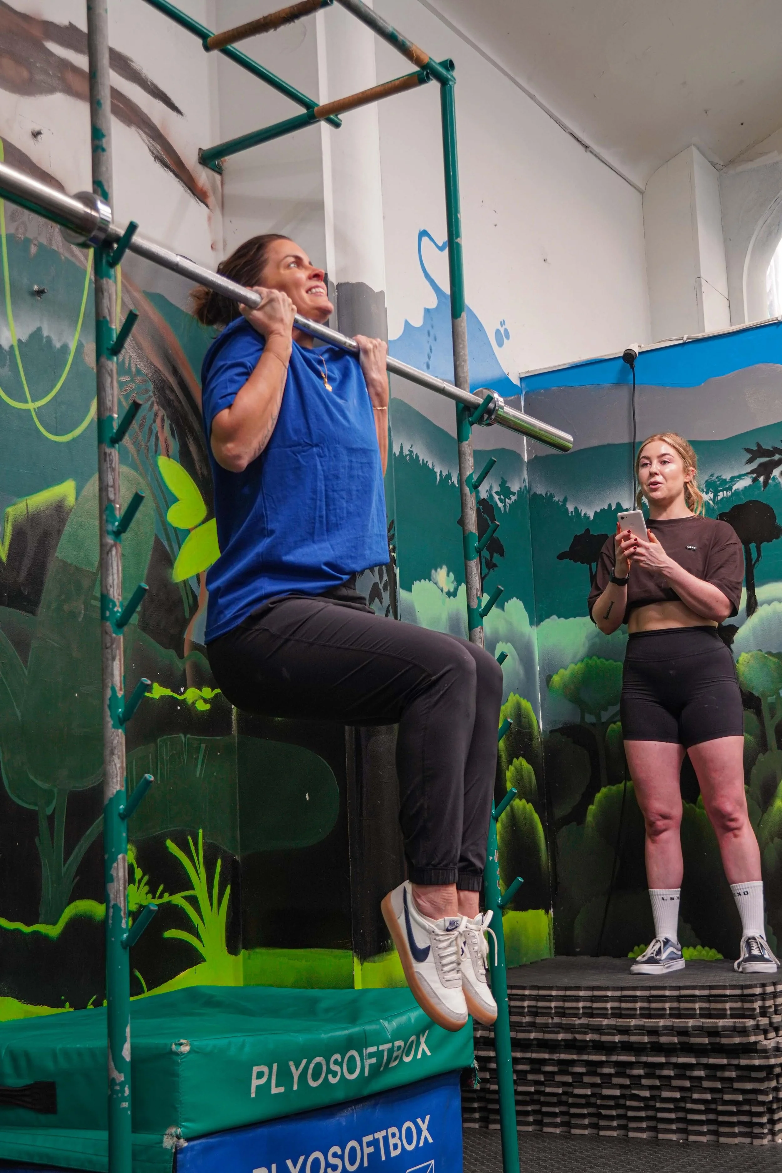 Woman performing a chin-up — online pull-up coach for women