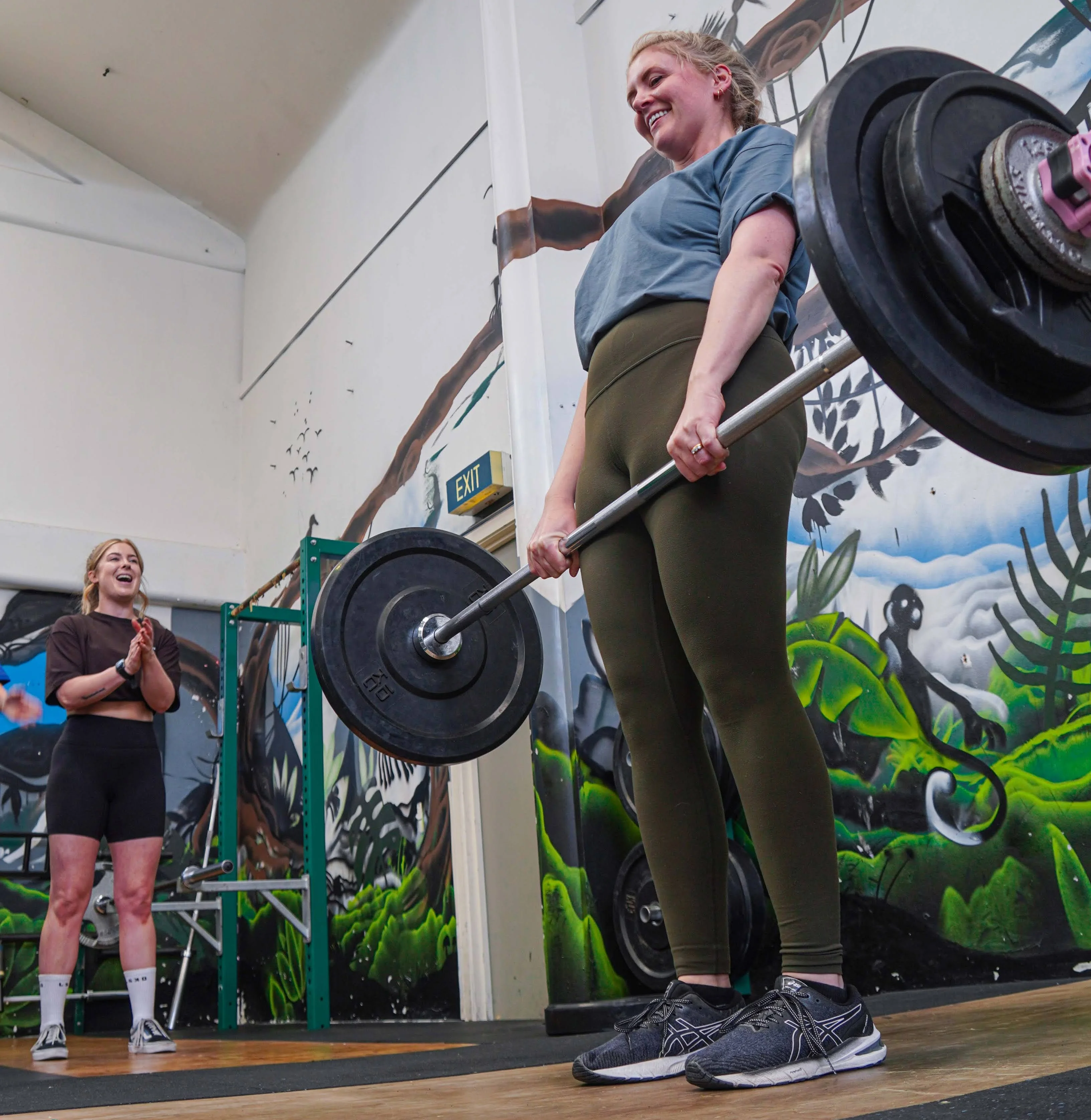Woman deadlifting — nutrition for women's strength training with Coach Lydia