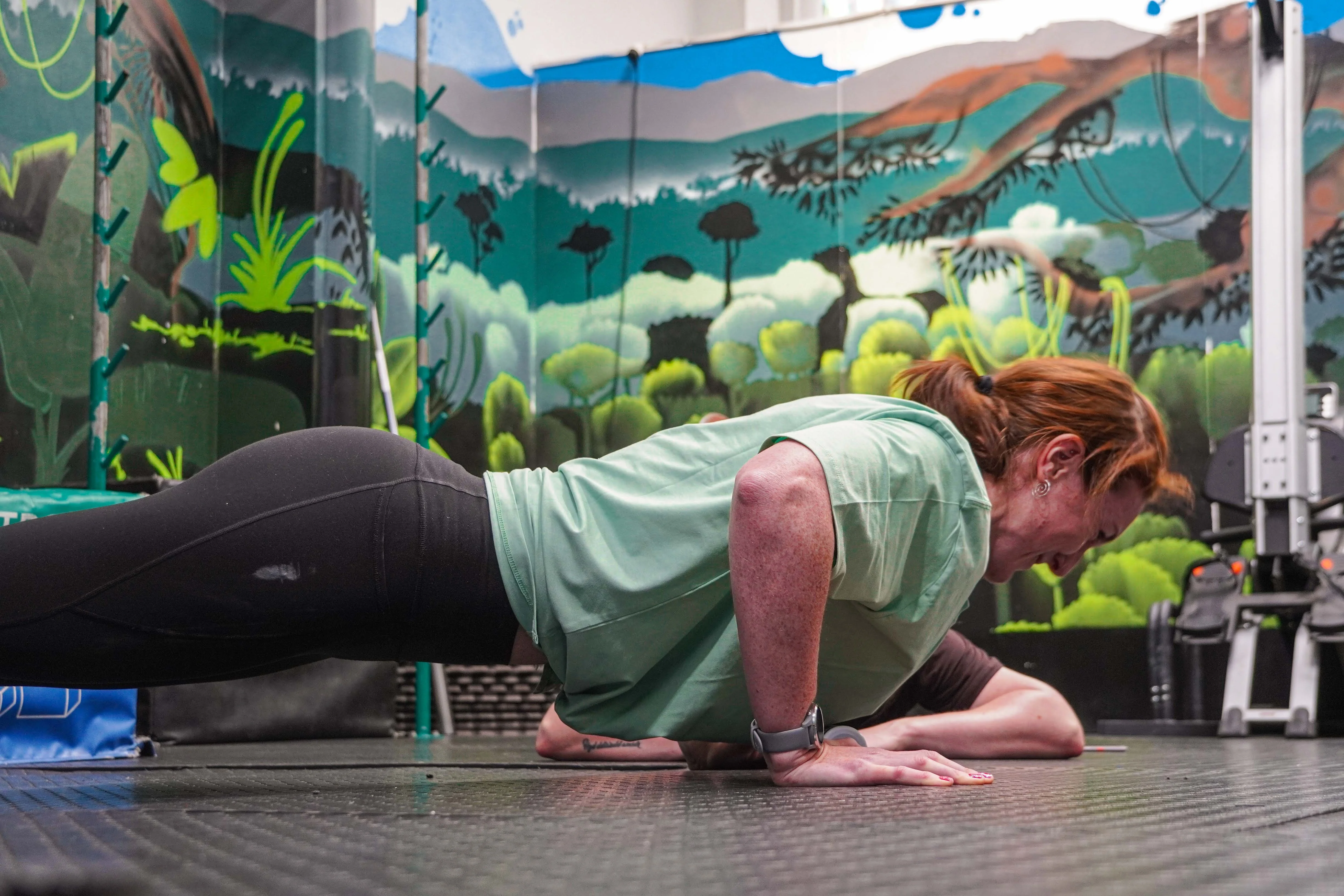 Woman doing a push-up — strength training for women with Coach Lydia